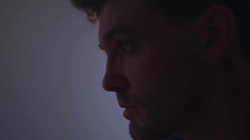 Side portrait of a man in an indoor space