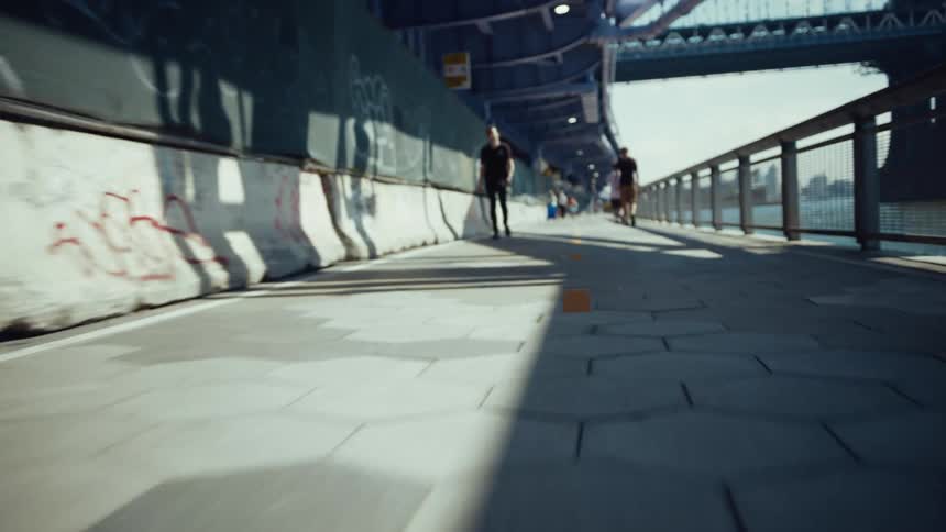 People walking on a seaside sidewalk in a city