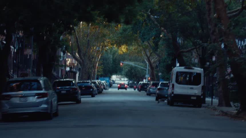 Cars travel on the streets in town