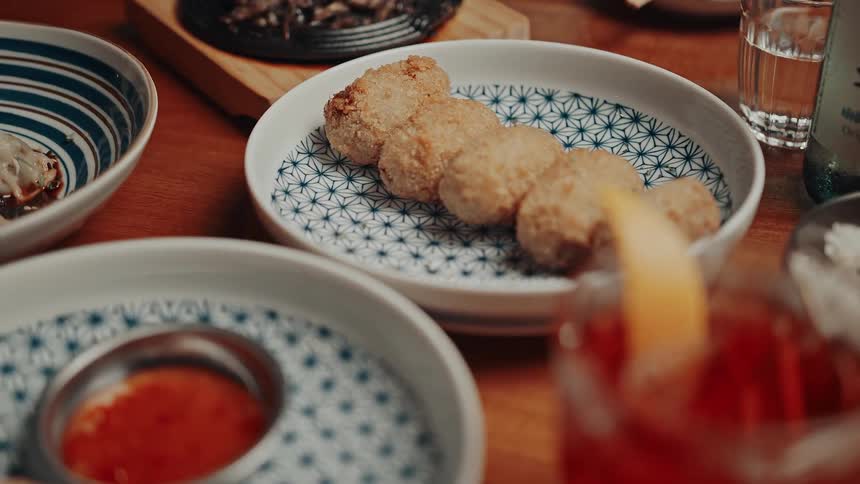 A variety of dishes are served on a dining table