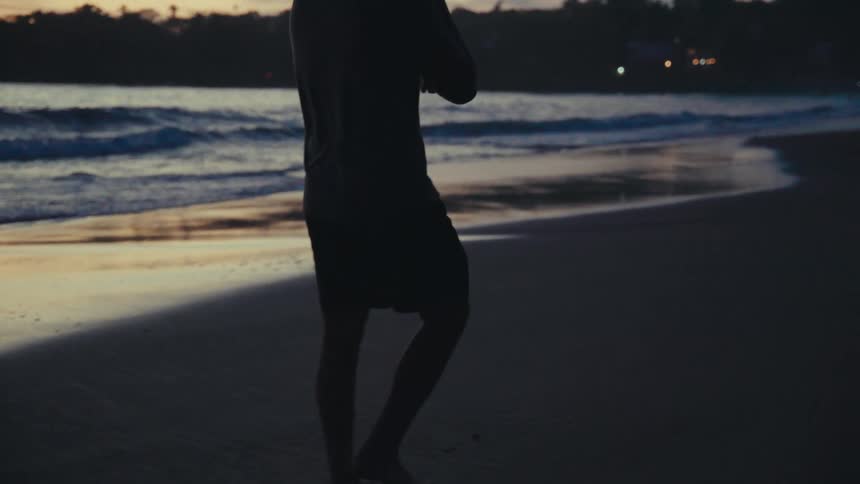 Father carrying his baby on the beach