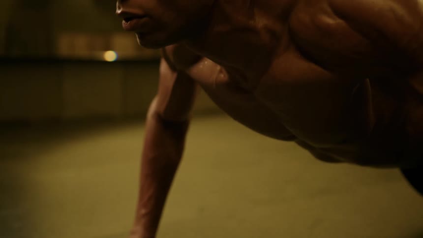 The man does slow push ups