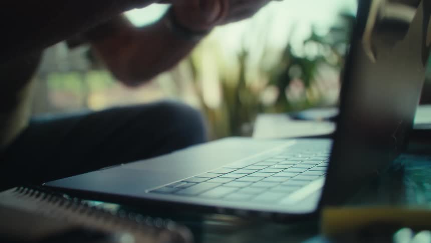 The man types on his keyboard briefly