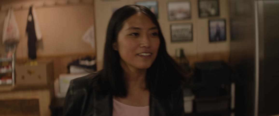 Close up portrait of a young woman walking through a restaurant