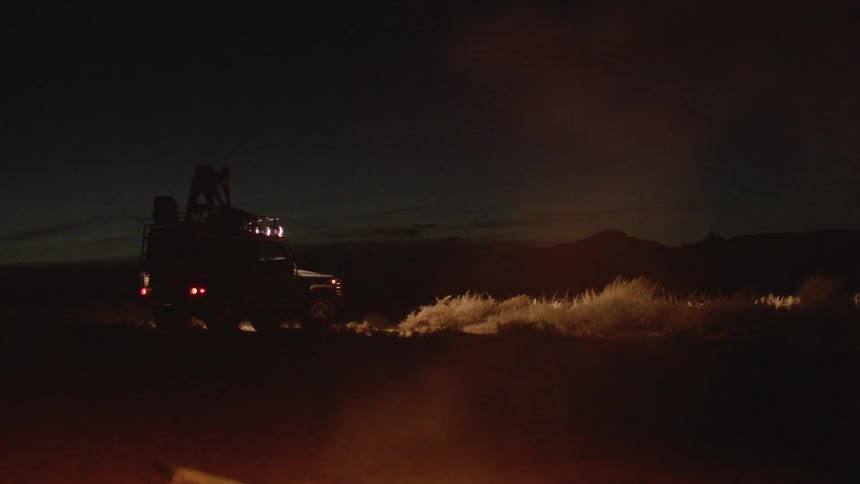 A jeep parked in the dark