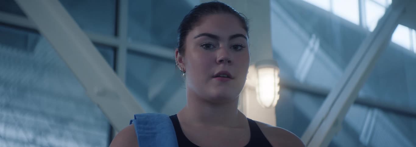 Portrait of a young woman in a swimsuit in an indoor space