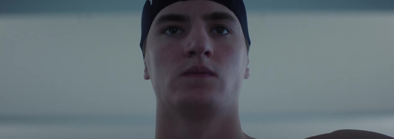 Portrait of a man in a swimming cap with a concentrated expression