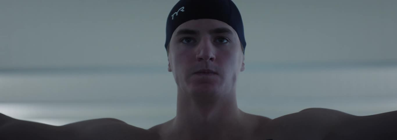 The diver puts his arms out