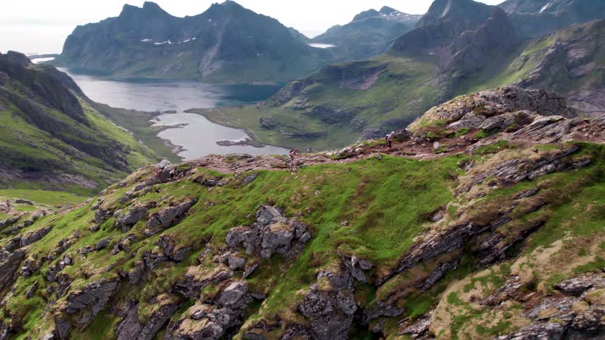 A person hikes up the mountain at midday