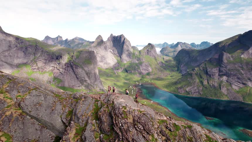 People are hiking on the peak of the mountain