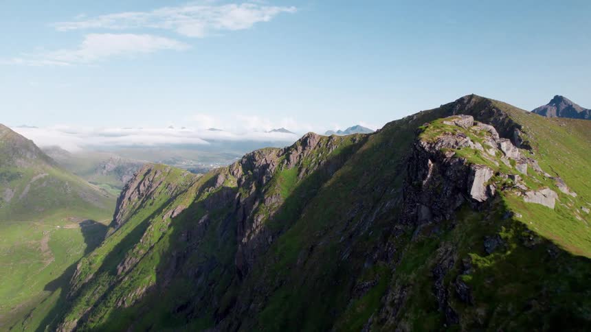 The tall mountains are covered with grass