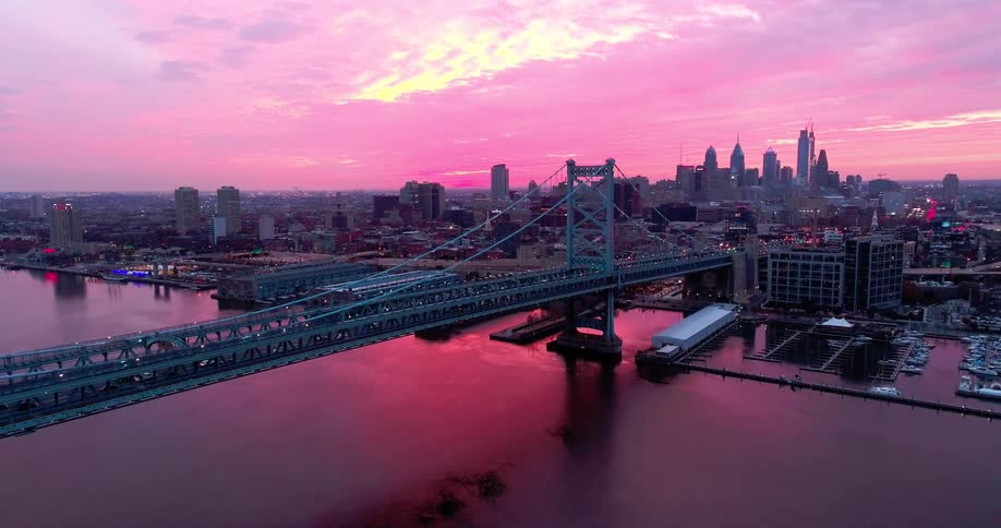 Traffic flows over the bridge into the big city