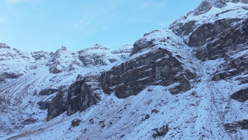The side of a snow covered mountain