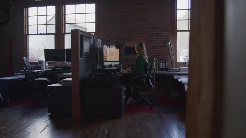 Woman is working at her desk in the office