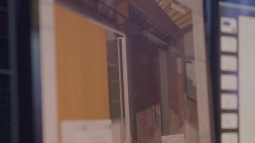 A person navigates through a computer rendering of a building interior