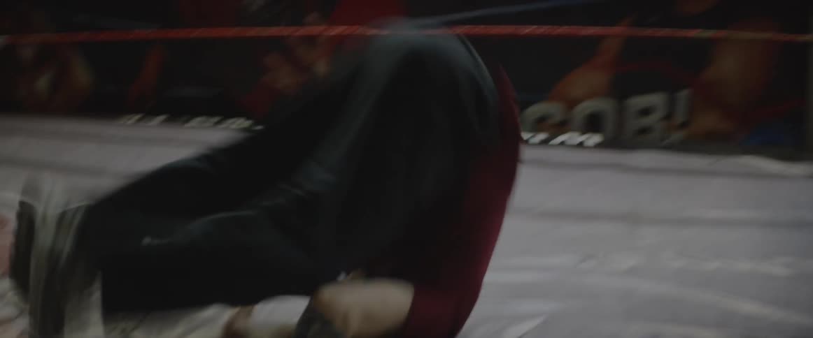 A man does multiple tumbles in the ring