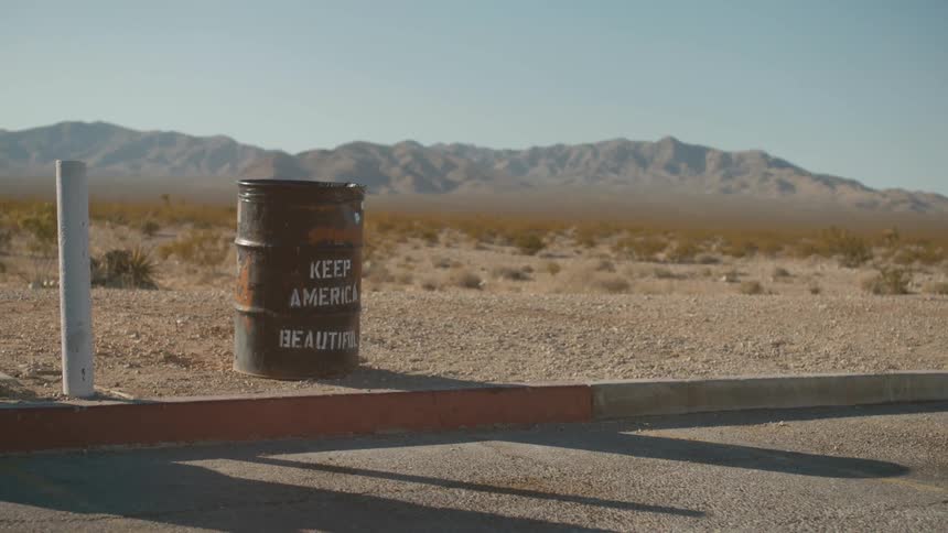 A trash barrel in the desert
