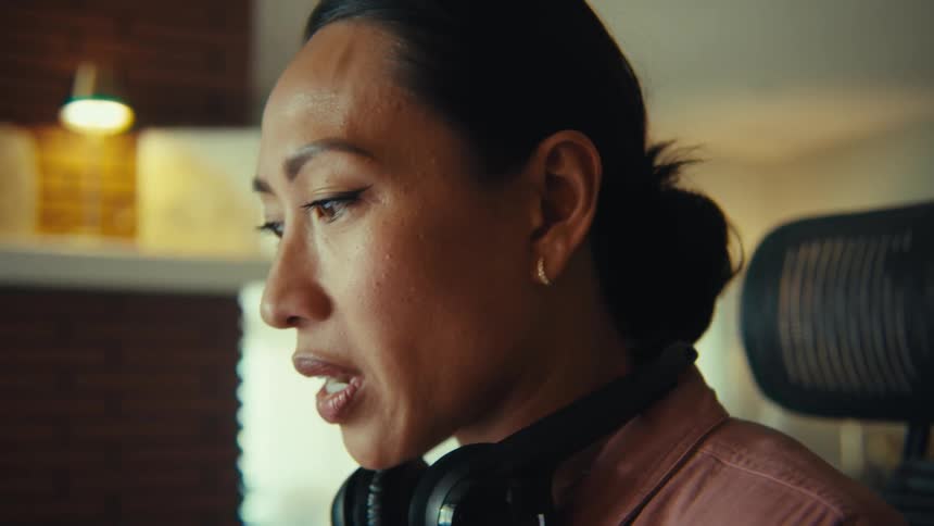 A woman talks to something off screen