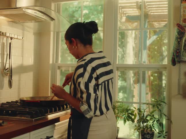Woman in apron cooking