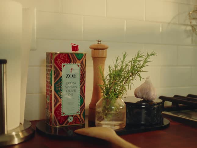 Culinary ingredients sit on the counter next to an empty stove top