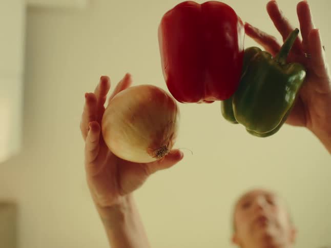 The cook puts vegetables on the table