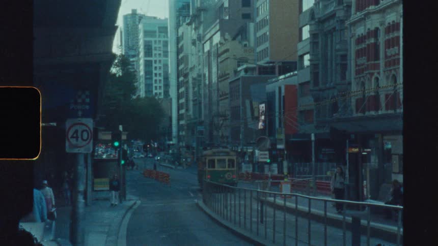 Pedestrians walk down the busy street