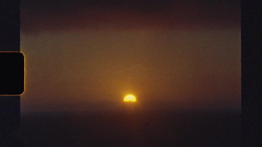 Orange sun setting on a cloudy evening