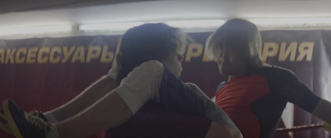 Wrestlers fight inside a wrestling ring
