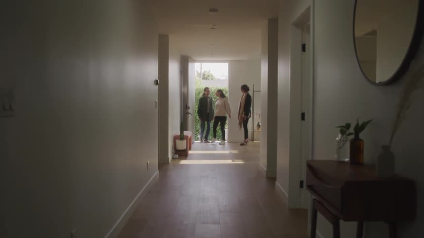 People are entering and checking out a new home