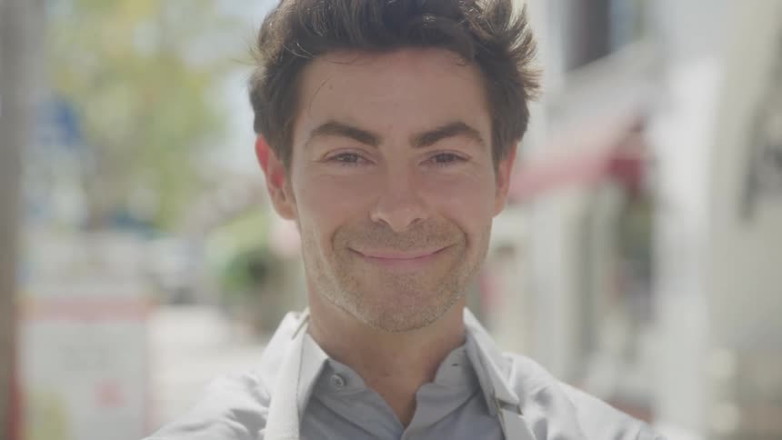 Man with happy expression in an outdoor environment