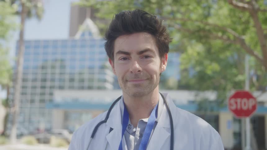 The doctor is outside the hospital