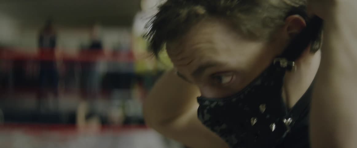 A man puts black mask on his face
