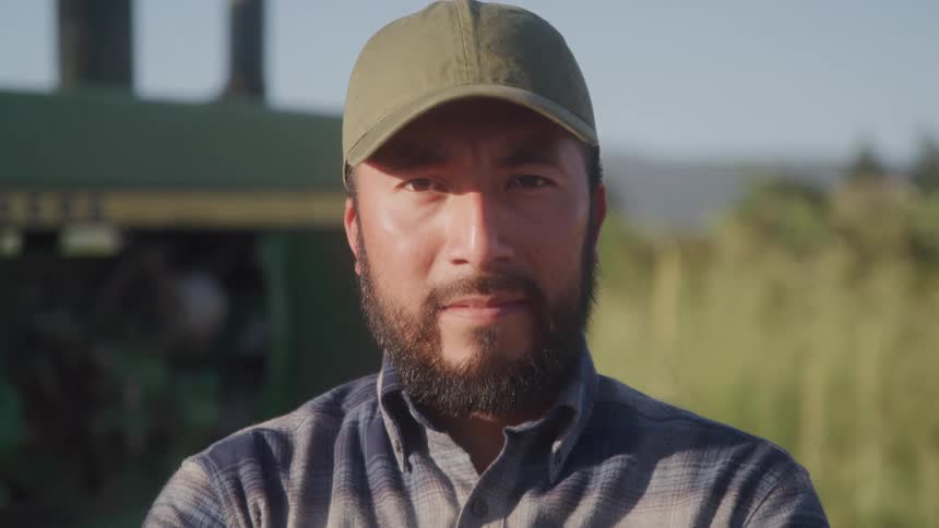 A man looks at the camera