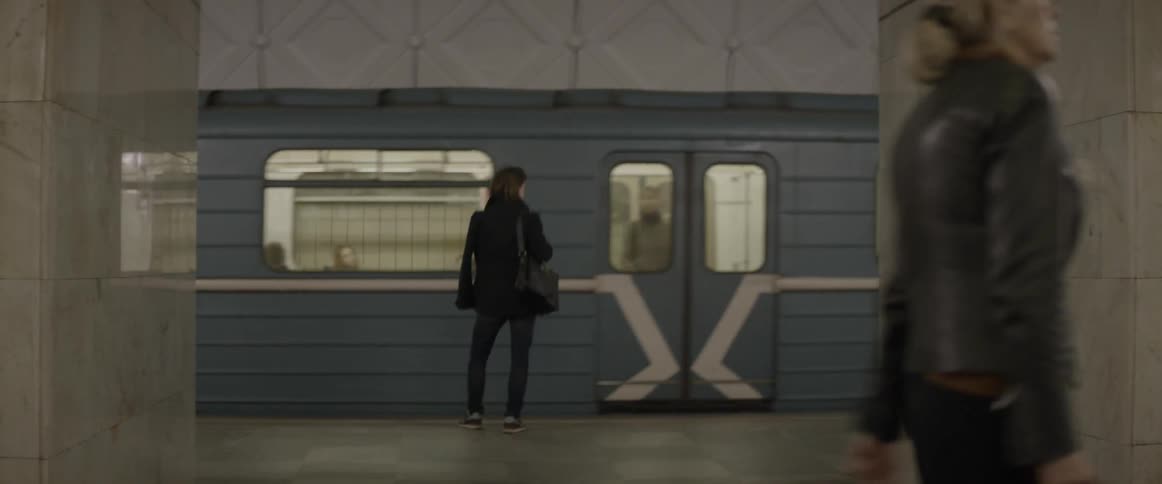 A person waiting for the subway to stop so they can aboard