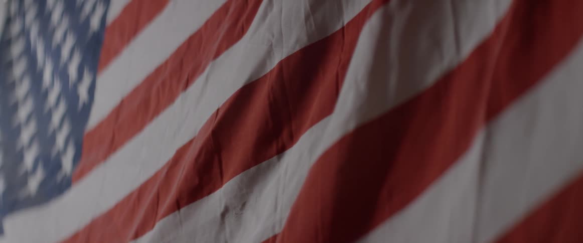 The stripes of an american flag are shown
