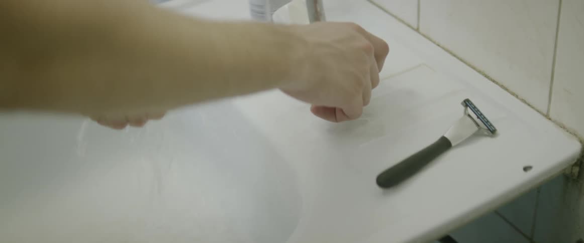 A person is watching their hands