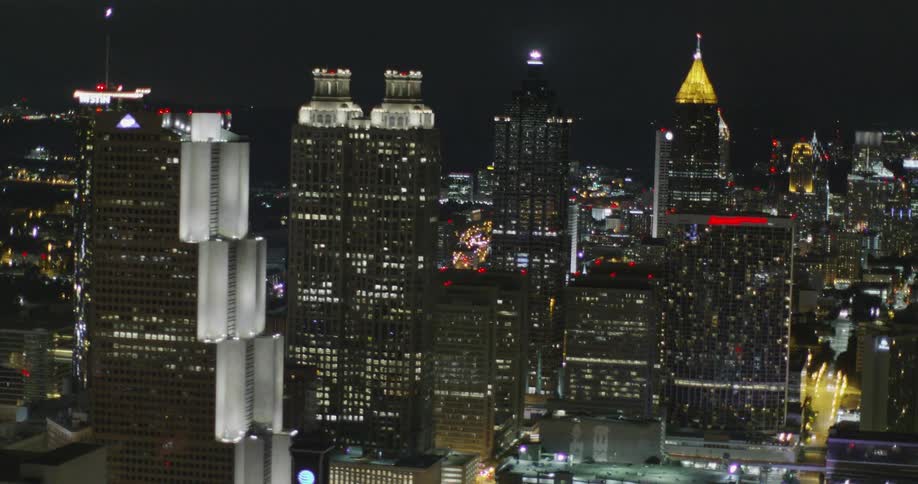 City buildings are shown at night