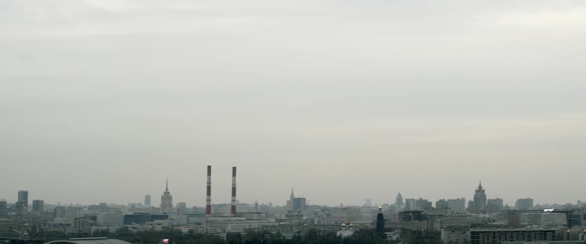 City buildings are shown in the distance