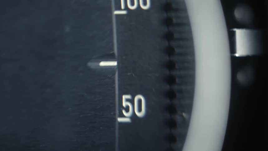 A closeup of a mechanical counter or meter with numbers scrolling