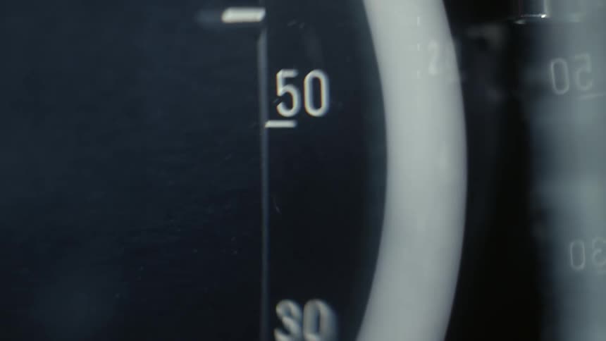 Dial spinning up and down to reveal different numbers with small tick marks underneath them
