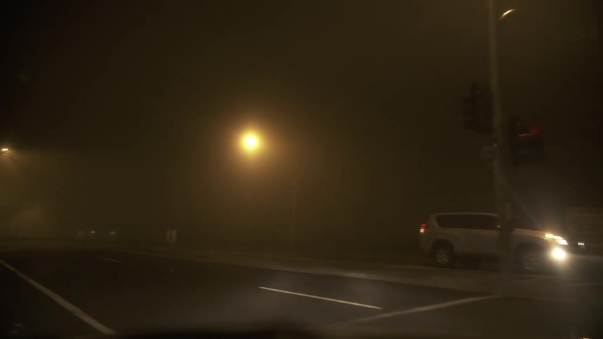 Turning a corner on a city street at night