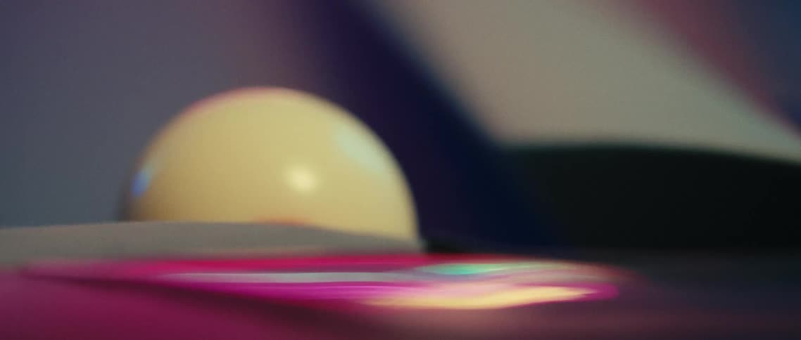 Billiard ball rolls across the billiard table and drops into a corner pocket