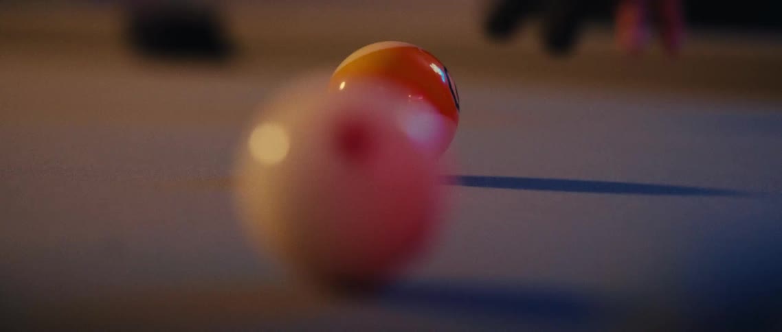 Snooker ball moving across a table