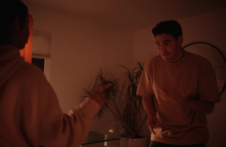A couple dancing together indoors happily