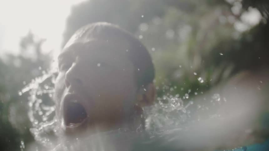 A man is swimming around in the water