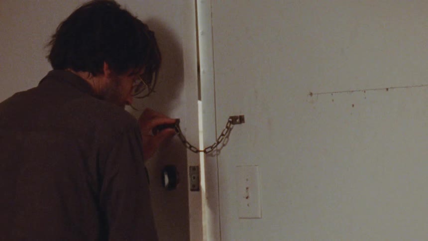 Man opening the door for his friend to enter