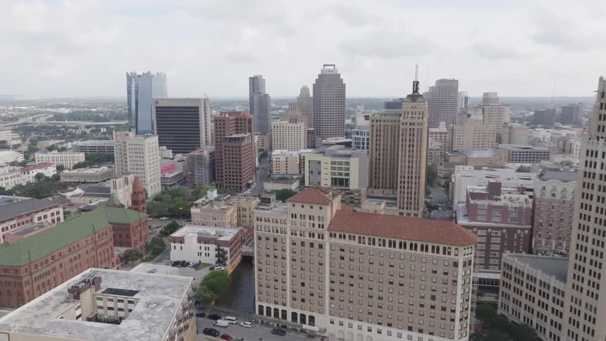 A city skyline with a series of highrise buildings and skyscrapers at midday