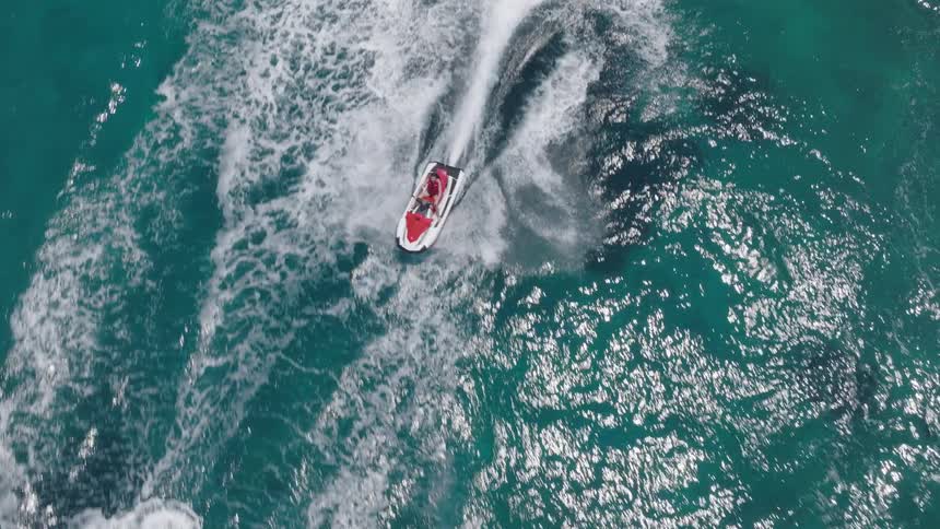 Person riding a jet ski in the ocean