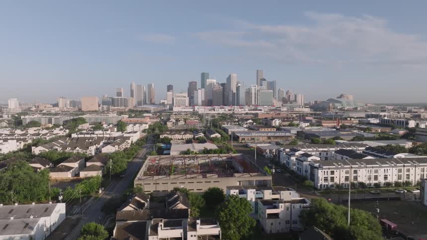 Aerial panorama of a suburb with skyscrapers in a metropolis in the background