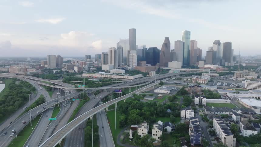 Panorama of viaducts in a metropolis with skyscrapers in the background